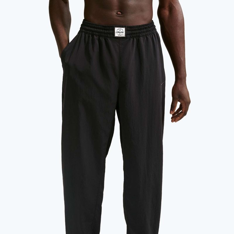 Штани чоловічі Nike N.A.C. Dri-Fit Woven black/pale ivory/black 4