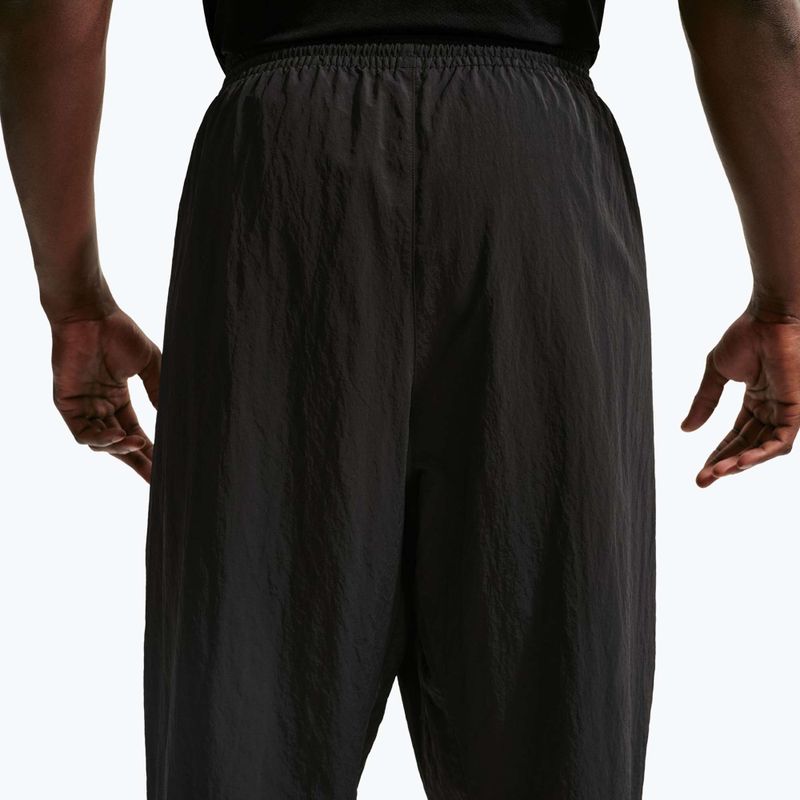 Штани чоловічі Nike N.A.C. Dri-Fit Woven black/pale ivory/black 6